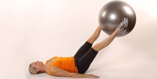 Holding a gymnastic ball between the raised legs develops the lower press